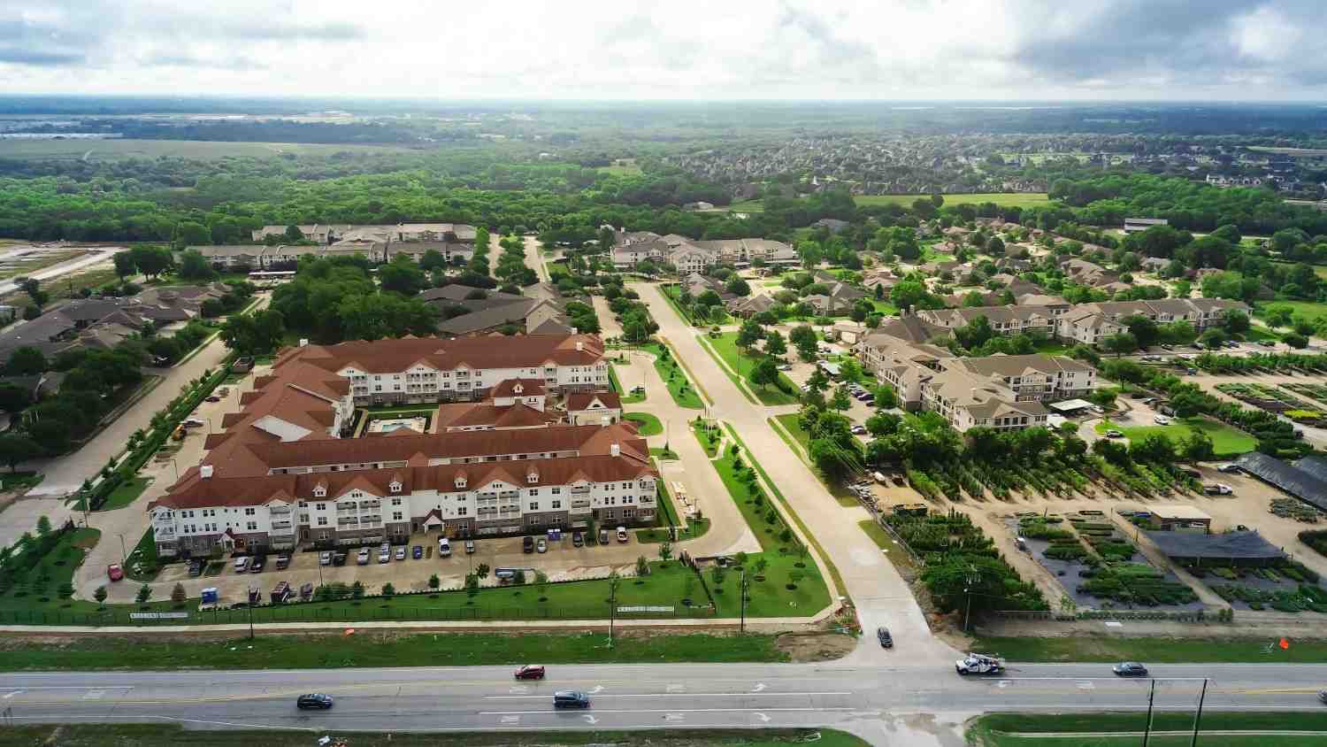 Aerial view of a skilled nursing facility campus with landscaped grounds