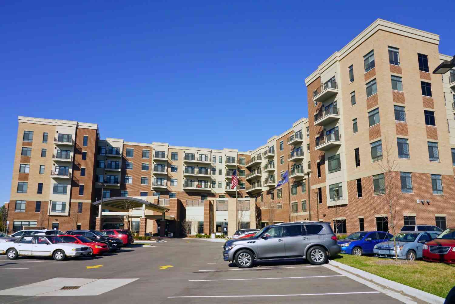 Bright modern skilled nursing facility entrance on a clear day